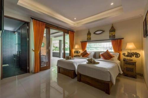 Postel nebo postele na pokoji v ubytování Gefecon Villa Ubud
