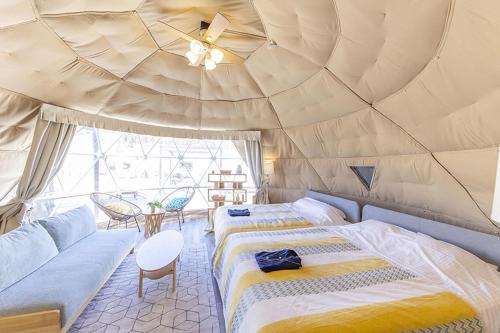 Postel nebo postele na pokoji v ubytování Glamping&Port結