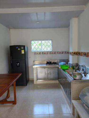 A kitchen or kitchenette at Olamar Hostal