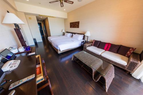 Postel nebo postele na pokoji v ubytování Kafuu Resort Fuchaku Condo Hotel