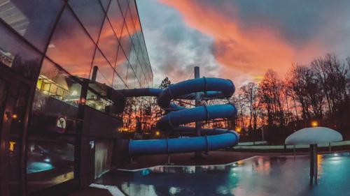 a water slide in front of a building at Noclegi u Sylwii przy Termach w Cieplicach in Jelenia Góra