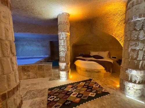 a bedroom with a bed in a large room at Angel View Suites in Goreme