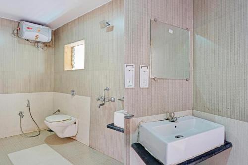 a bathroom with a white toilet and a sink at Sagar Villa in Mahabaleshwar