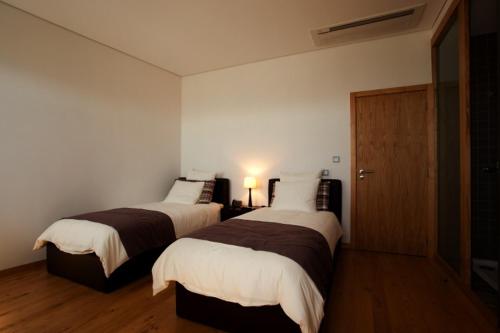 Llit o llits en una habitació de Casa Da Quinta De Vale D' Arados
