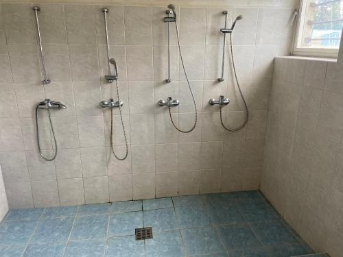 a bathroom with two showeroses and a tiled shower at Soukeník FCT in Sezimovo Ústí