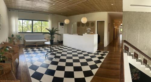 a lobby with a checkered floor at Casa Maria's Bed & Breakfast in Echague