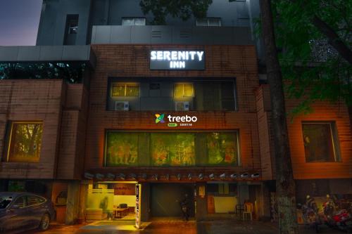 a building with a sign that reads security inn at Treebo Trend Serenity Inn in Pune