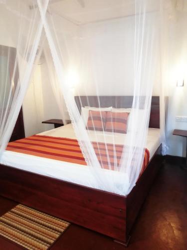 Una cama o camas en una habitación de Ella Festoon