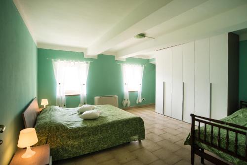 Ένα ή περισσότερα κρεβάτια σε δωμάτιο στο Agriturismo Il Frutteto
