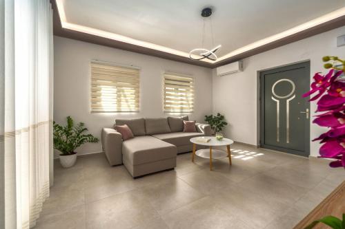 a living room with a couch and a table at Villa Debora in Zakynthos Town