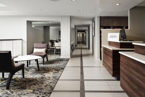 a hallway with chairs and tables in a building at Residence Inn Philadelphia Conshohocken in Conshohocken