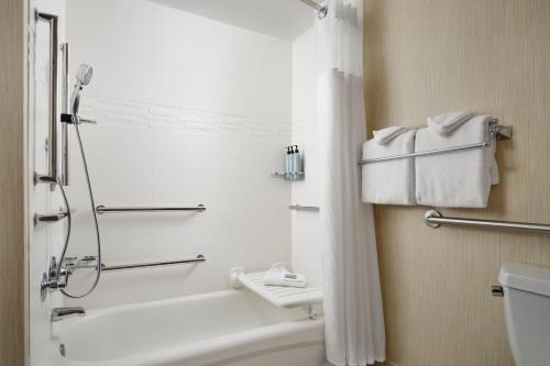 a bathroom with a shower and a tub and a toilet at Residence Inn Philadelphia Conshohocken in Conshohocken