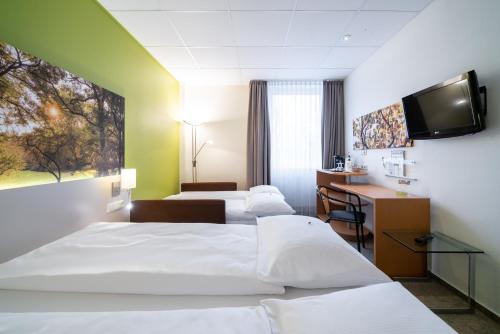 Katil atau katil-katil dalam bilik di Anders Hotel Walsrode