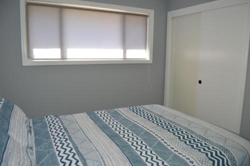 Ein Bett oder Betten in einem Zimmer der Unterkunft Tranquil and Modern Home 3br