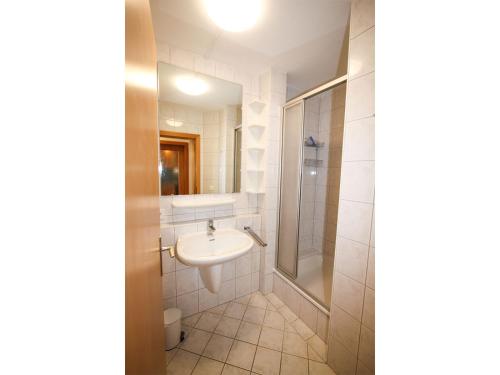 a bathroom with a sink and a shower at Ferienwohnung Königsleiten 77 - Top 34 in Königsleiten