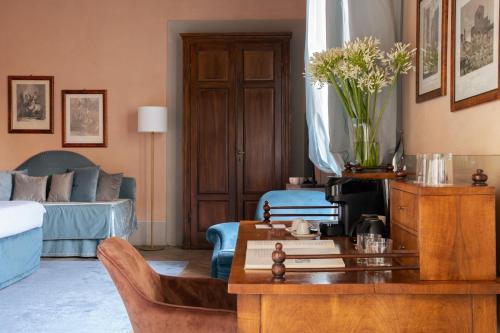 a living room with a couch and a table at Loggiato Dei Serviti in Florence