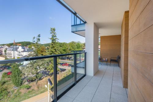 a view from the balcony of a house at Sun & Beach Apartments Bel Mare with Parking by Noclegi Renters in Międzyzdroje