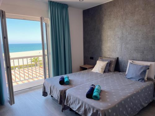 a bedroom with a bed with a view of the ocean at Villa Dru in Roquetas de Mar
