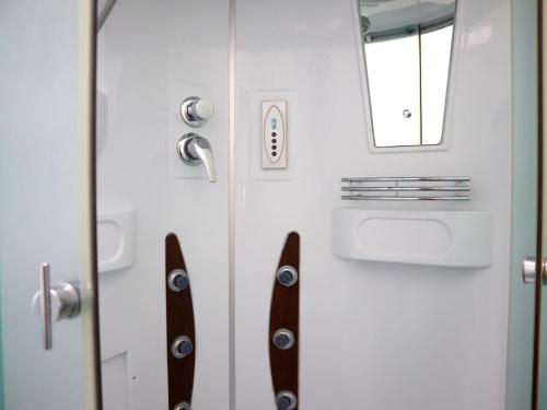 a door with a pair of skis on it at Jansyn Hotel Restaurant in Karakol