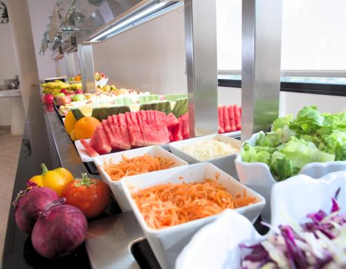 a buffet filled with different types of fruits and vegetables at Hotel Taimar in Costa Calma