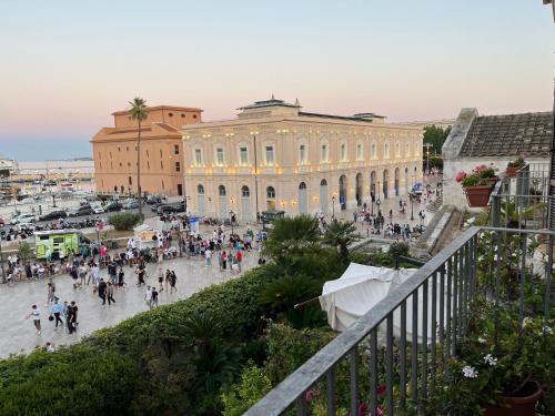 a group of people walking in front of a building at Una finestra sul mare in Bari