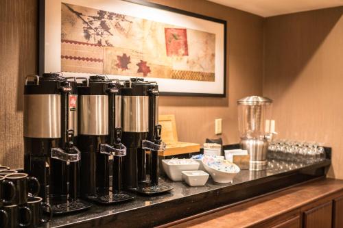 a bar in a hotel room with a coffee machine at Courtyard by Marriott Seattle Bellevue/Downtown in Bellevue