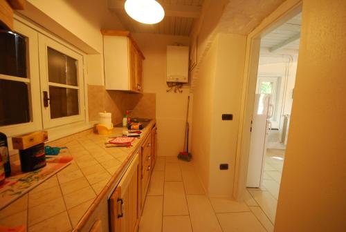 a kitchen with a sink and a counter top at Spoleto by the pool in Spoleto