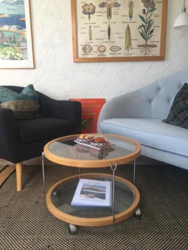 a living room with a couch and a coffee table at Experience the Provençal dream in Taradeau