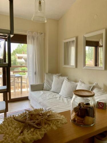 a living room with a couch and a table at Aestas in Neos Marmaras
