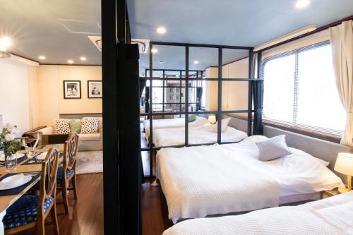 Postel nebo postele na pokoji v ubytování 【5/24NEW OPEN】浅草徒歩3分/Max9名/無料駐車場/渋谷直通