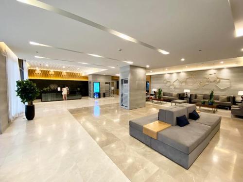 Posezení v ubytování Cozyhome by LV & SG - S residences MOA PASAY unit condo