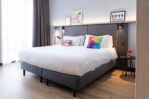 Ένα ή περισσότερα κρεβάτια σε δωμάτιο στο ibis Styles Den Haag Scheveningen