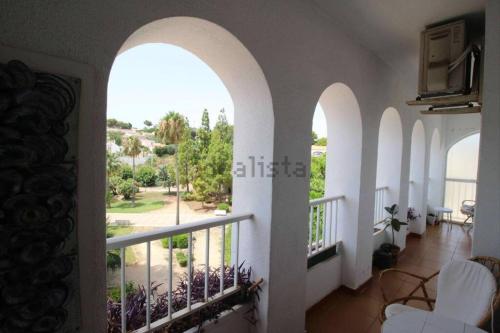 a view from the living room of a house with arches at Apartamento en el casco antiguo. in Altea