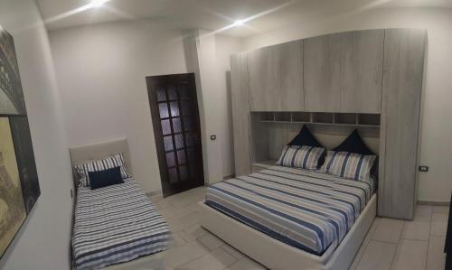 Ένα ή περισσότερα κρεβάτια σε δωμάτιο στο Bidda Mores Appartamenti- I Velieri