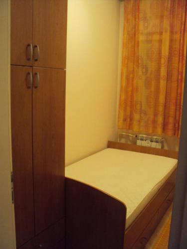 Un pat sau paturi într-o cameră la Apartman Milja