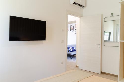 TV a/nebo společenská místnost v ubytování Palazzo Cilento - Appartamenti a due passi dal mare