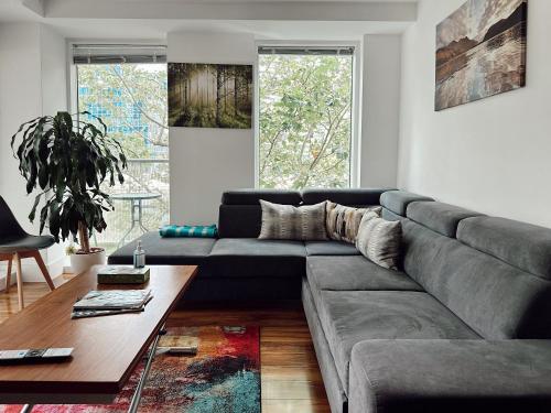 a living room with a couch and a table at Canary Wharf - Luxury Apartments in London