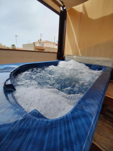a water slide in a building with a window at Hostal Manel in Pineda de Mar