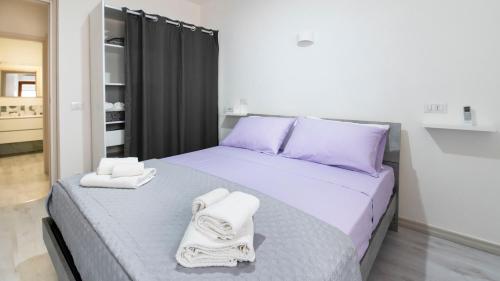 Posteľ alebo postele v izbe v ubytovaní Casa di Elena