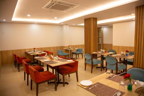 A restaurant or other place to eat at Naveen Residency
