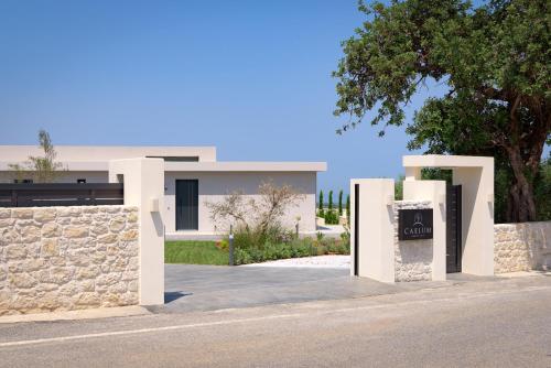 a house with a sign in front of it at Caelum Villa, By Hellocrete in Píkris