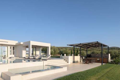 an image of a villa with a swimming pool at Caelum Villa, By Hellocrete in Píkris