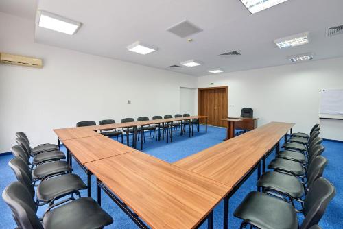 a conference room with a long table and chairs at Hotel Fara - Marina Cape in Aheloy