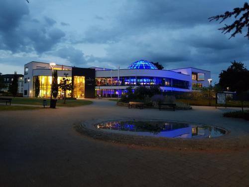 a large building with a blue dome in front of it at Ferienwohnung Salinchen in Bad Rothenfelde