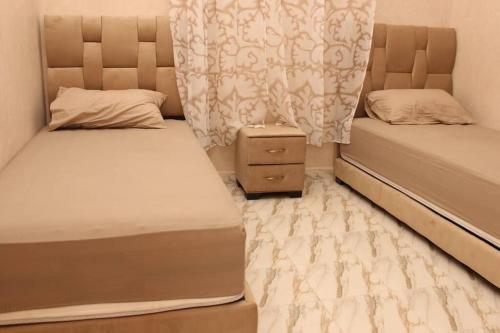 Un pat sau paturi într-o cameră la Magnifique villa à Marrakech