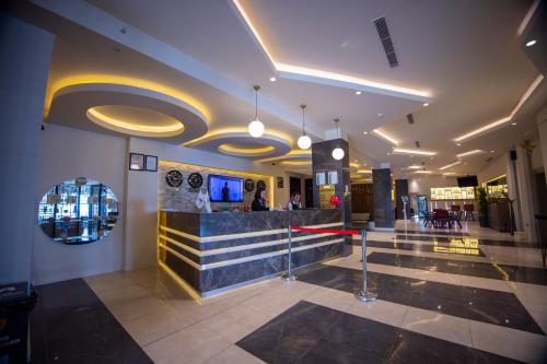 a lobby of a building with a bar in it at Hilly Hotel in Edirne