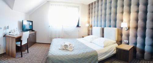 Ένα ή περισσότερα κρεβάτια σε δωμάτιο στο Hotel Cykada