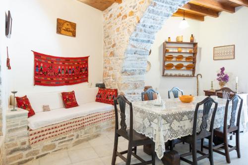 a living room with a table and a couch at Zeus House in Philotium