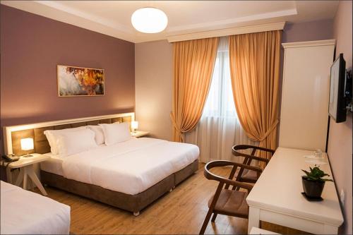 HotelVila 22 tesisinde bir odada yatak veya yataklar