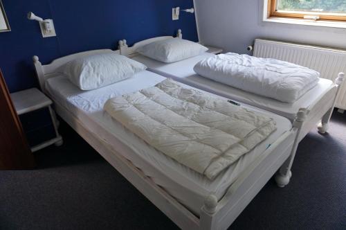Postel nebo postele na pokoji v ubytování Kustverhuur, Park Schoneveld, Zeester 54